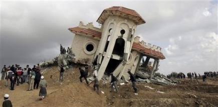 2720882788-palestinians-gather-outside-the-damaged-house-of-the-fayyad-family-2.jpg
