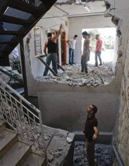 309976051-various-unidentified-members-of-the-said-family-work-to-demolish.jpg