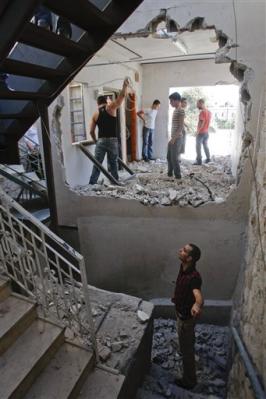 309976051-various-unidentified-members-of-the-said-family-work-to-demolish.jpg