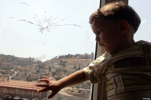 palestinian-child-gun-shot-bullet-hole-window.jpg